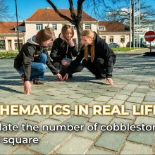 Children in a town square counting cobble stones