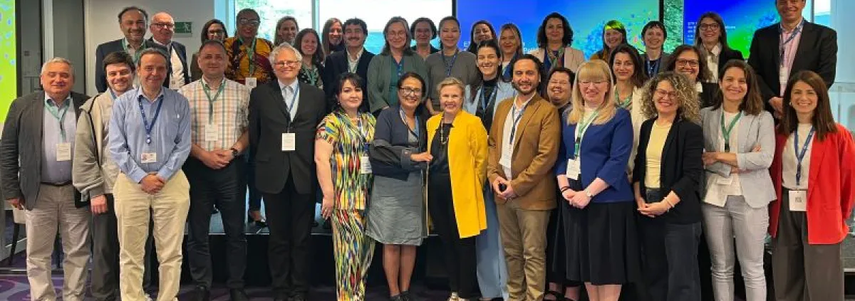 A grGroup photo of participants at an international migration and skills research forum.